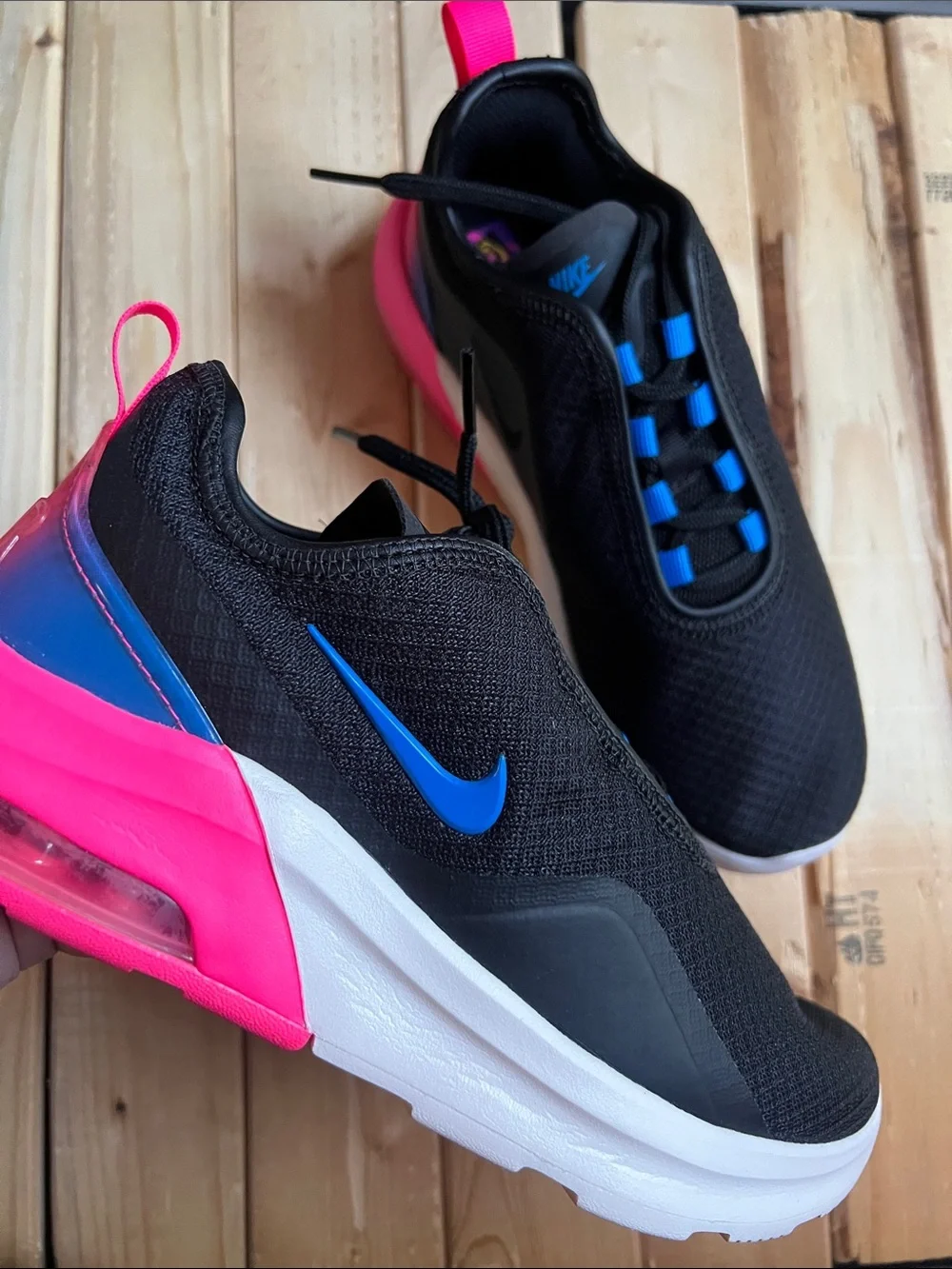 Nike Women's Black Sneaker with Blue Swoosh and Pink Heel